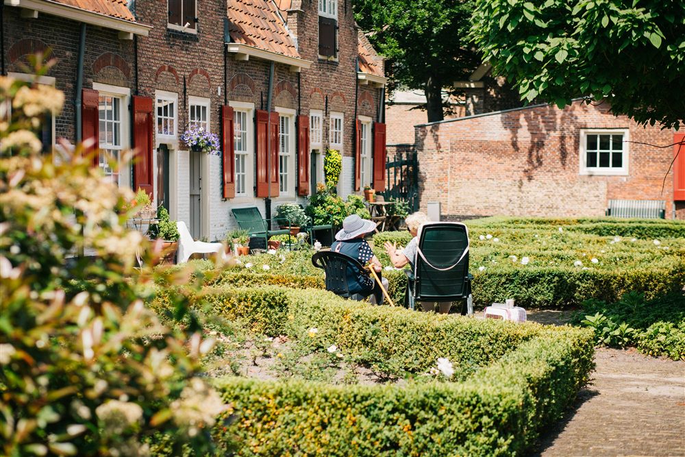 Seniors relaxing in a home garden