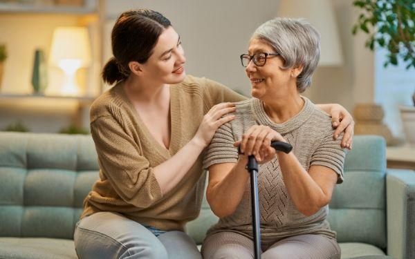 Family caregiver supporting an older adult at home