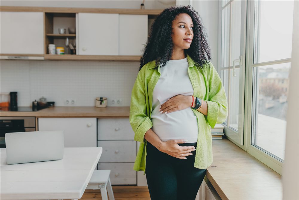 Expecting mother in a kitchen